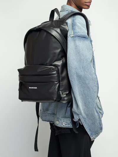 A man wearing a padded leather backpack from Balenciaga