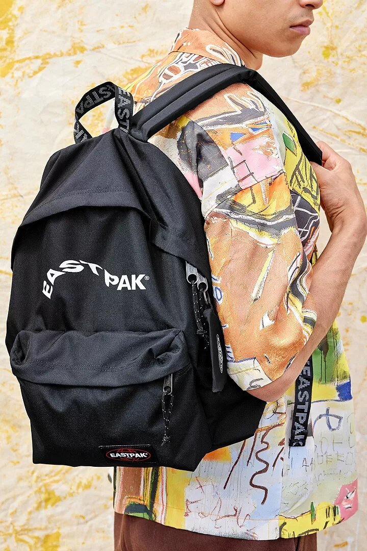 A man wearing one of Eastpak's black backpacks