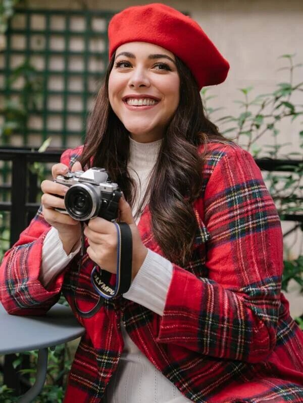 Brunette woman wearing a red beret from the brand Shein