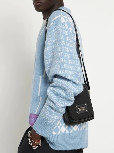 Man wearing a nylon shoulder bag range by Versace Jeans Couture 