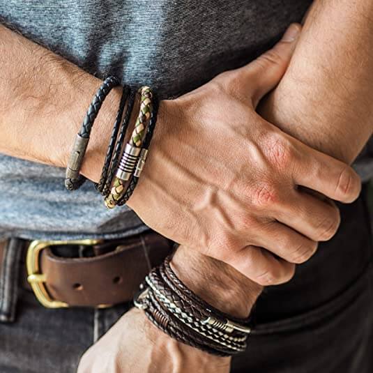 Man wearing multiple leather bracelets