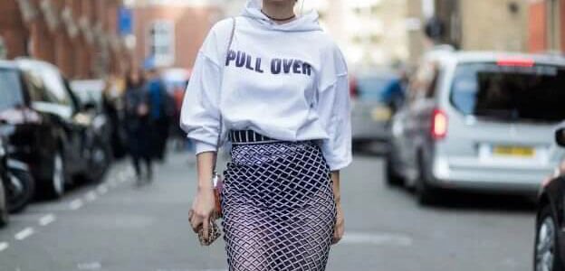 Woman wearing a hoodie sweatshirt with a high-waisted tulle skirt