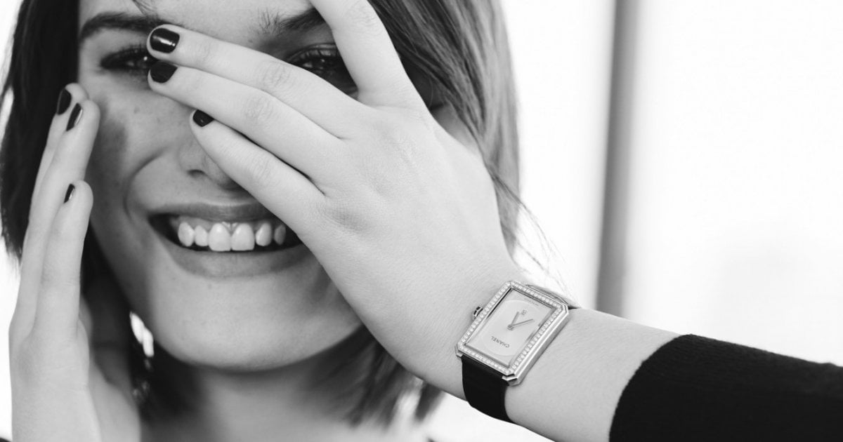 Woman wearing a black watch