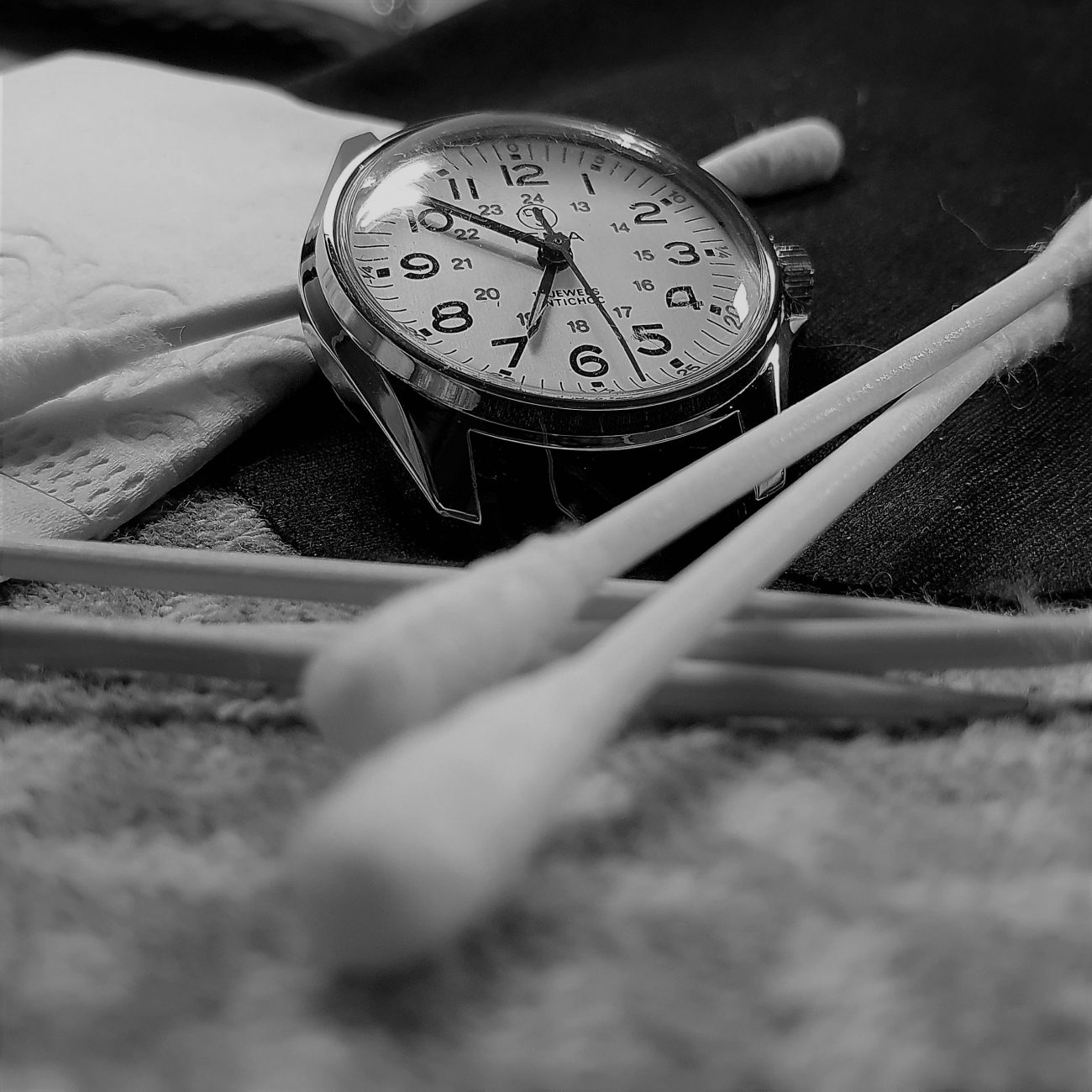 A watch cleaned with a cotton swab