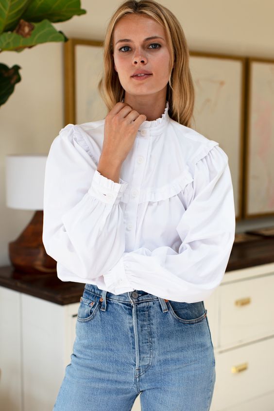 A woman with a white shirt body and jeans