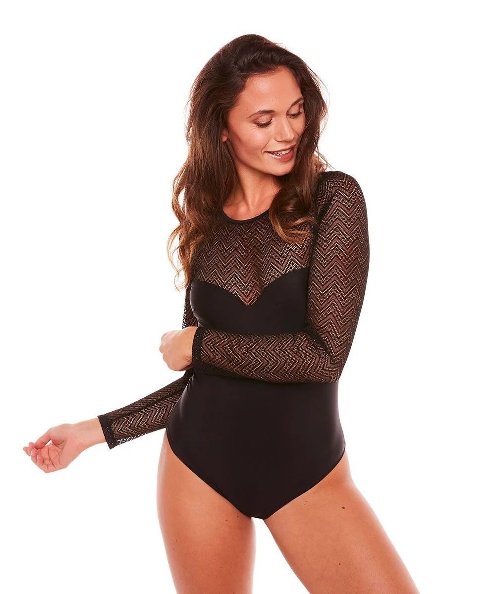 woman in a long-sleeved transparent black bodysuit