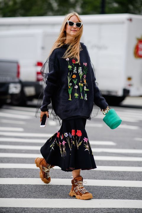 Woman wearing an outfit adorned with flowers