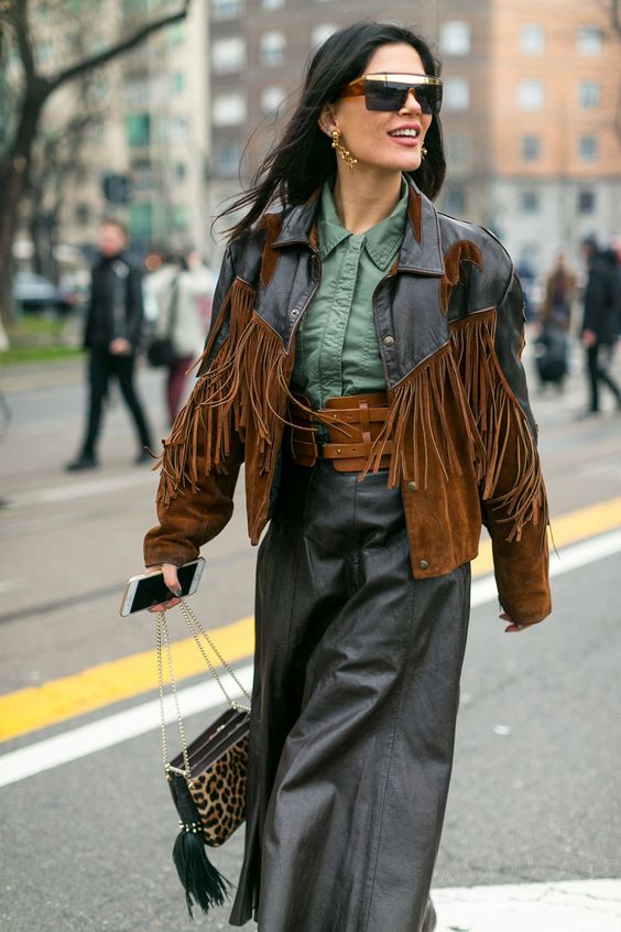 woman wearing a fringed leather jacket