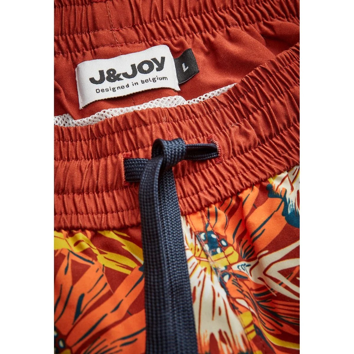 Orange patterned swim trunks by J&Joy