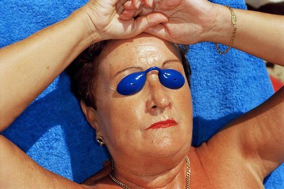 Photo of Martin Parr woman sunbathing with eye patch