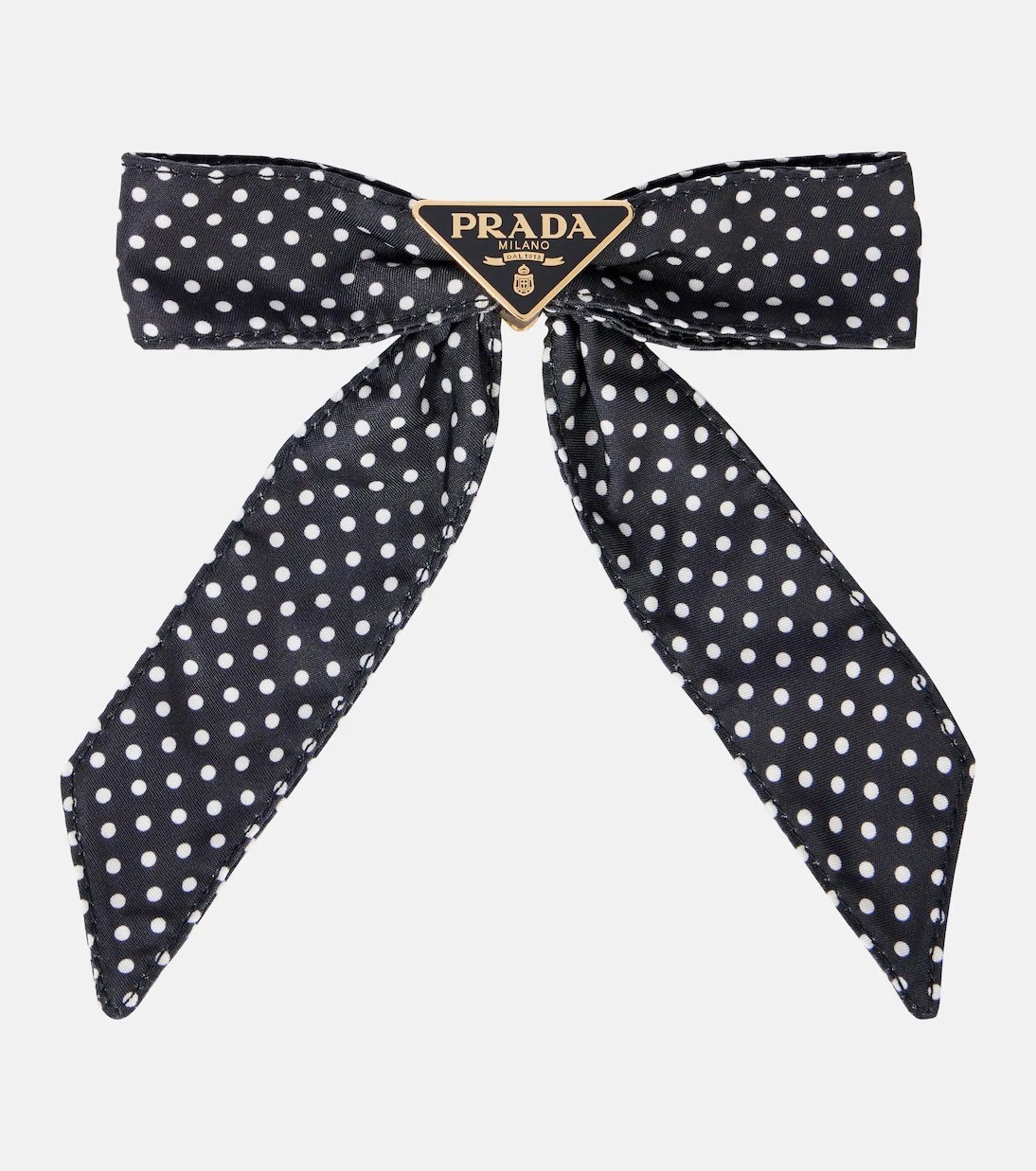 The polka dot print is back like never before! 44 Prada polka dot bow barrette